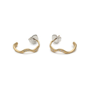 24 mm 14K gold hoop earrings with six flush-set diamonds, inspired by rippling water.