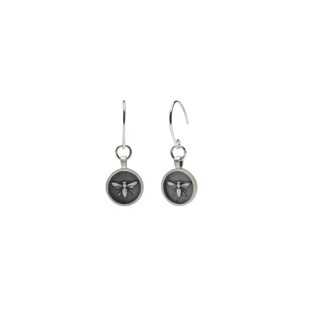 Oxidized sterling silver earrings with raised sculpted bees, inspired by the Forager Bee.