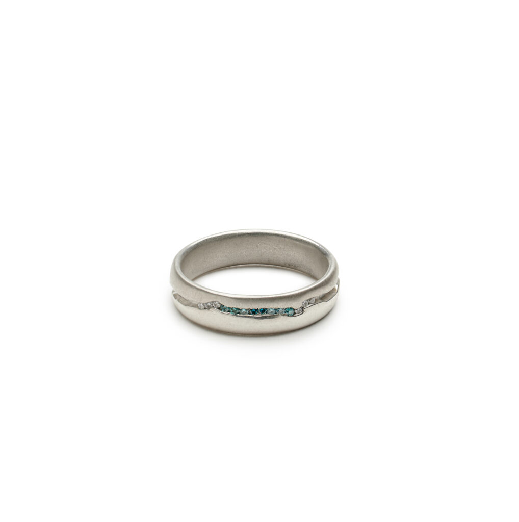 A sculptural ring inspired by Vermont’s Mad River, the River Eit Ring features twelve gradient diamonds that evoke moonlit water.