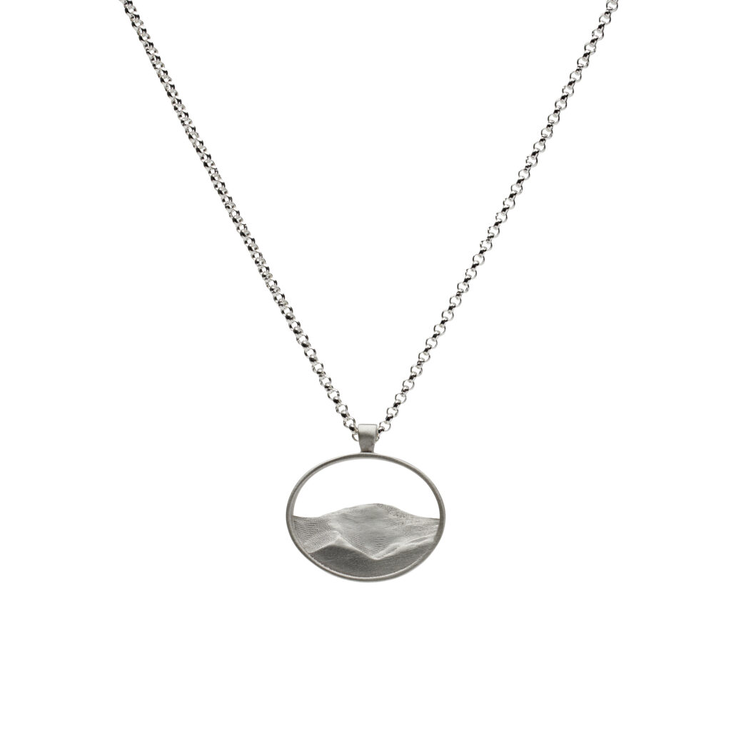 Sterling silver pendant depicting Mount Washington’s silhouette on an 18-inch chain.