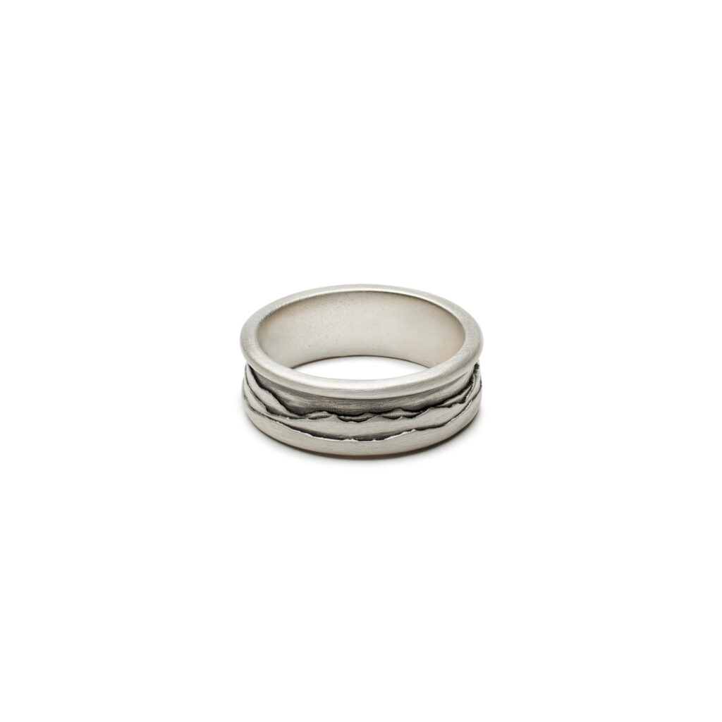 Oxidized satin sterling silver ring with a double-layer mountain silhouette inspired by Vermont’s distant ridges.