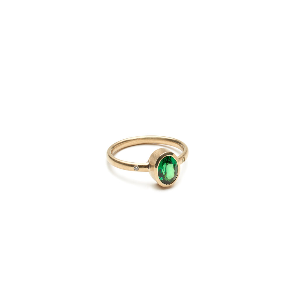 A vibrant tsavorite garnet ring inspired by the stillness of the forest floor. Beneath the Canopy pairs beautifully with the Meander, Sylvan Contour, and Traverse rings.