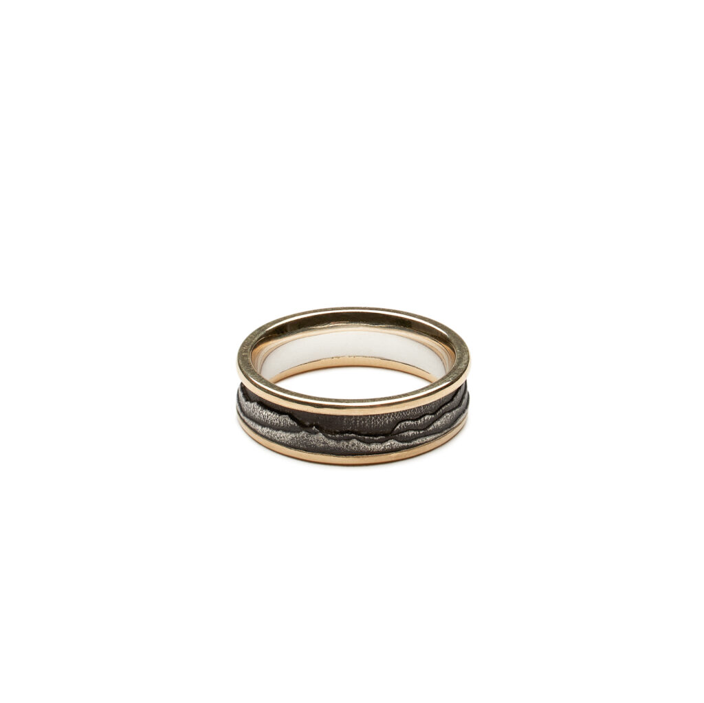 Passage ring featuring Green Mountain silhouette in oxidized sterling silver with gold edges, available in widths from 5 mm through 8 mm.