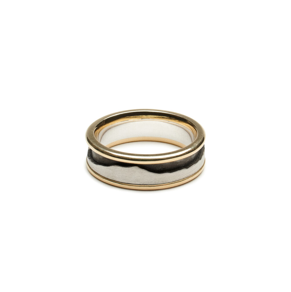 Last Light ring with sterling silver mountain design and 14K gold edges, 8 mm wide, Ridge Series nature-inspired ring.