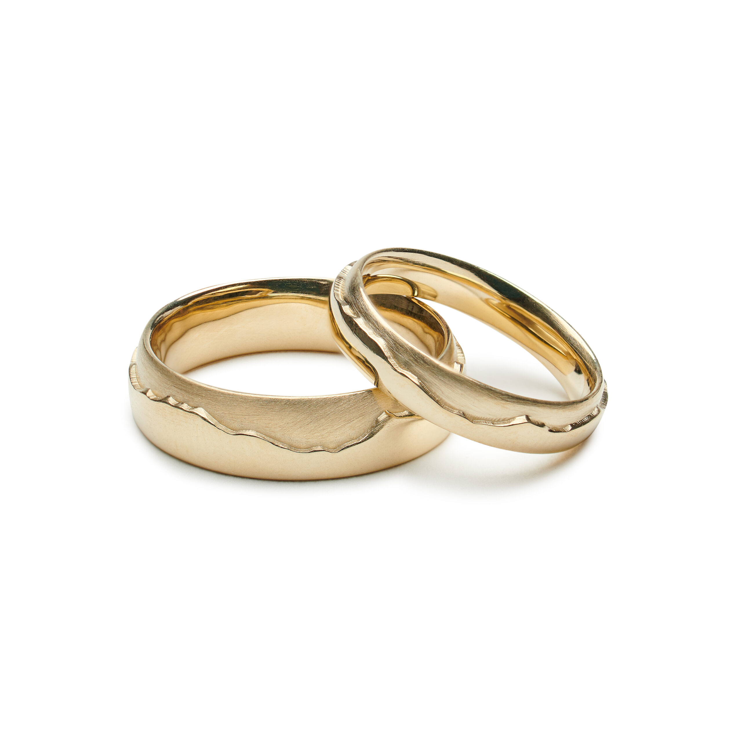 Gold rings depicting the profile of jay peak in vermont