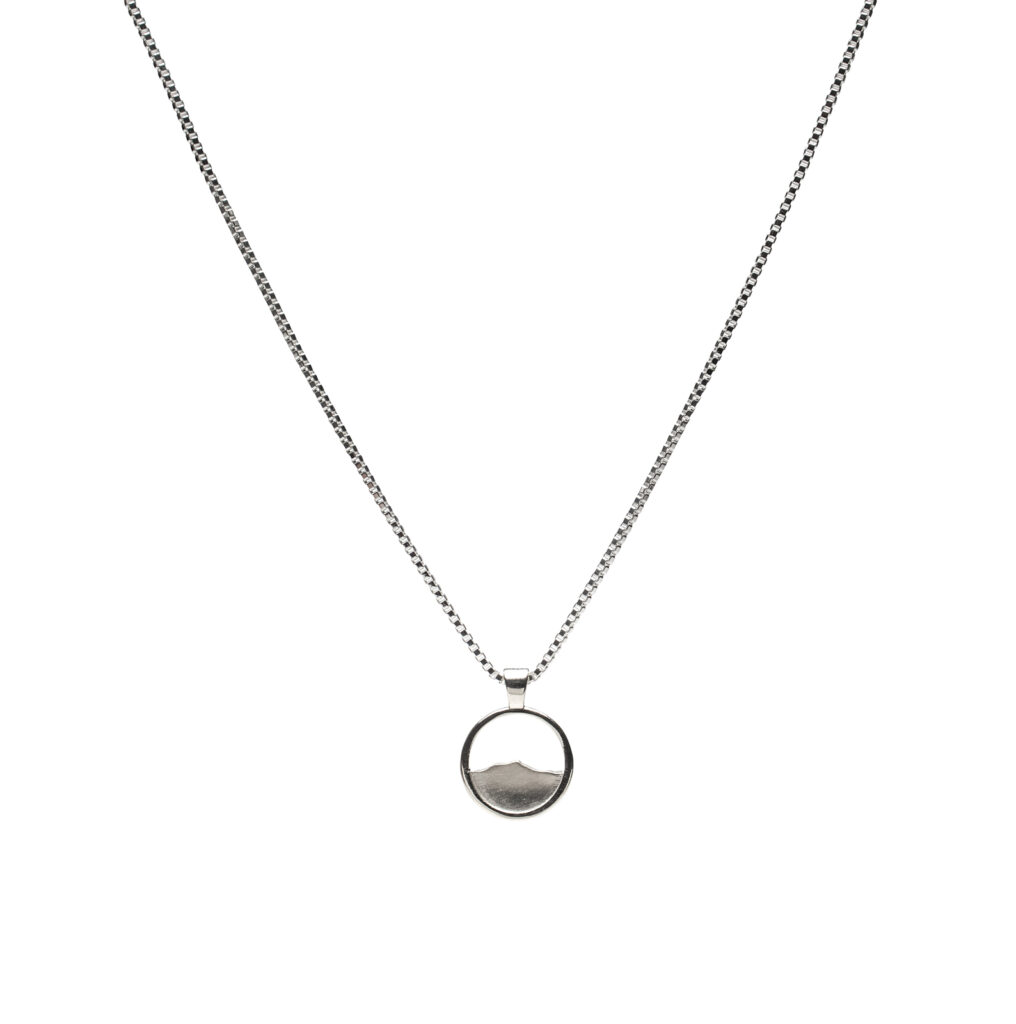 This little, elegant version of our classic Camel’s Hump pendant will quickly become your new everyday necklace. With its subtle profile of one of Vermont’s most beloved peaks, it’s a quiet tribute to the Green Mountains — perfect for layering or gifting