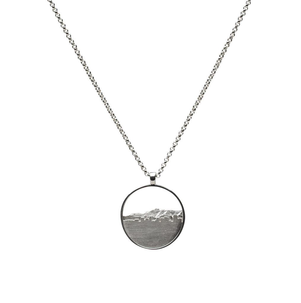 Sterling silver Wasatch View Pendant depicting Salt Lake City skyline rising toward the Wasatch Mountains on an 18-inch chain.