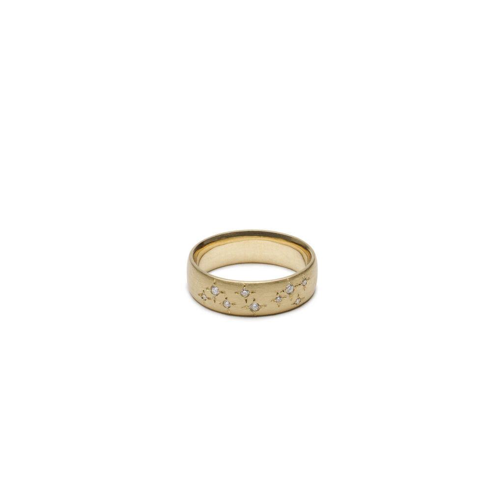 Starlit diamond ring in 14K yellow gold with bead-set diamonds scattered across a wide band.