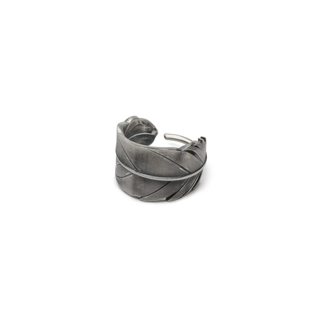 Oxidized sterling silver ring featuring a detailed raven feather with bold texture and an adjustable design.