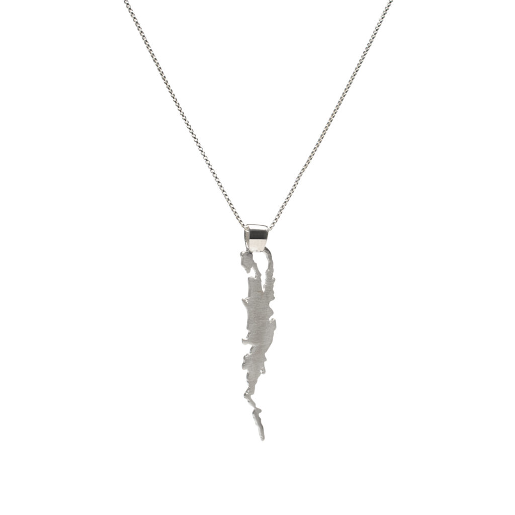 Sterling silver pendant shaped like Lake Champlain on a long chain.