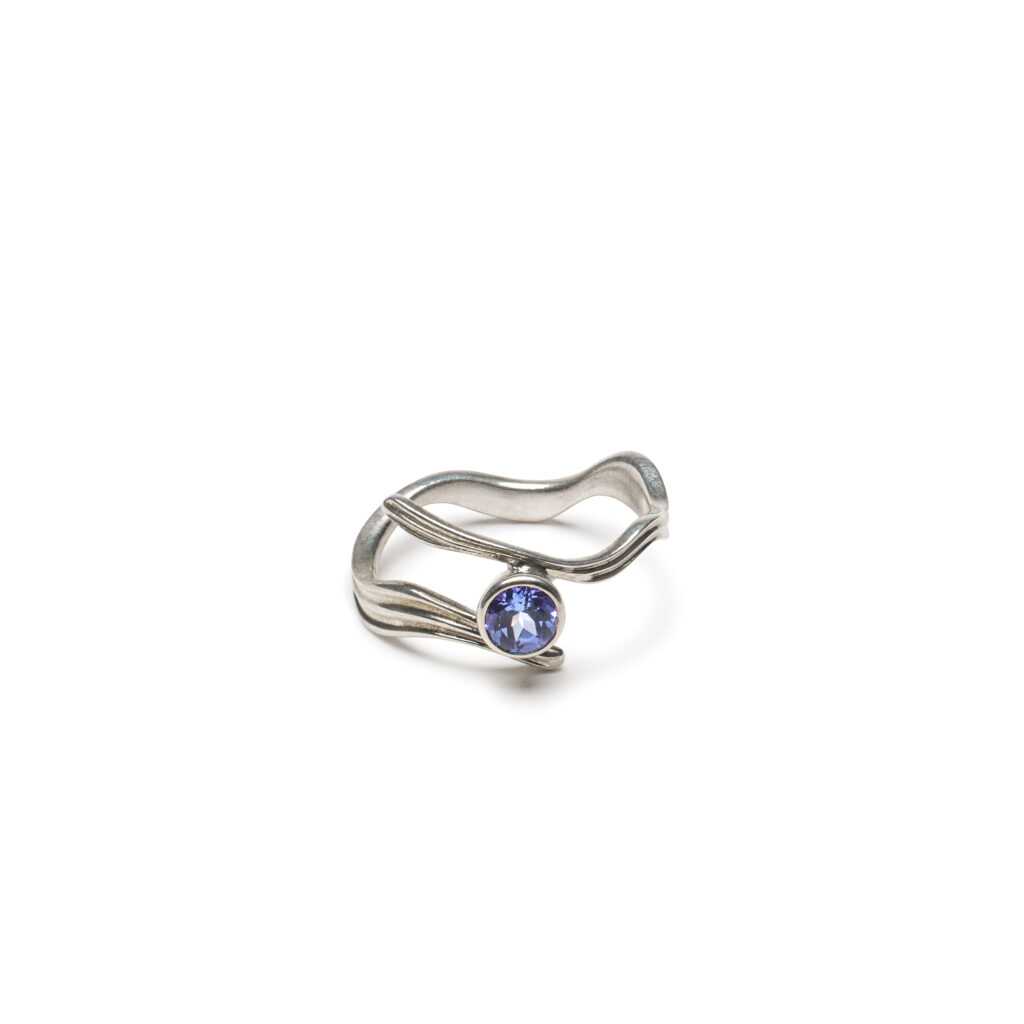 Blue-violet gemstone ring inspired by rivers and twilight light