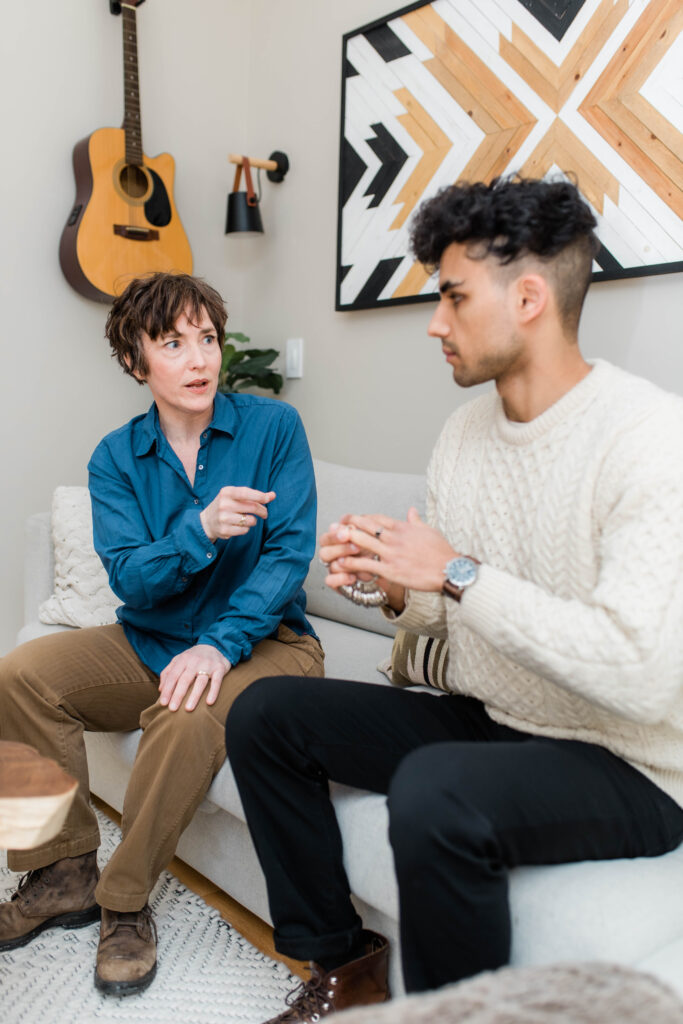 Custom jewelry consultation with client discussing design ideas, metals, and gemstones for a one-of-a-kind piece