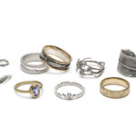 A collection of rings in gold and silver with forest inspired inspiration