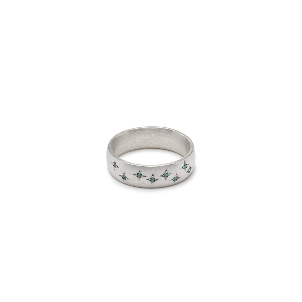 Sterling silver Winter Sky Starlit Band with three shades of blue diamonds.