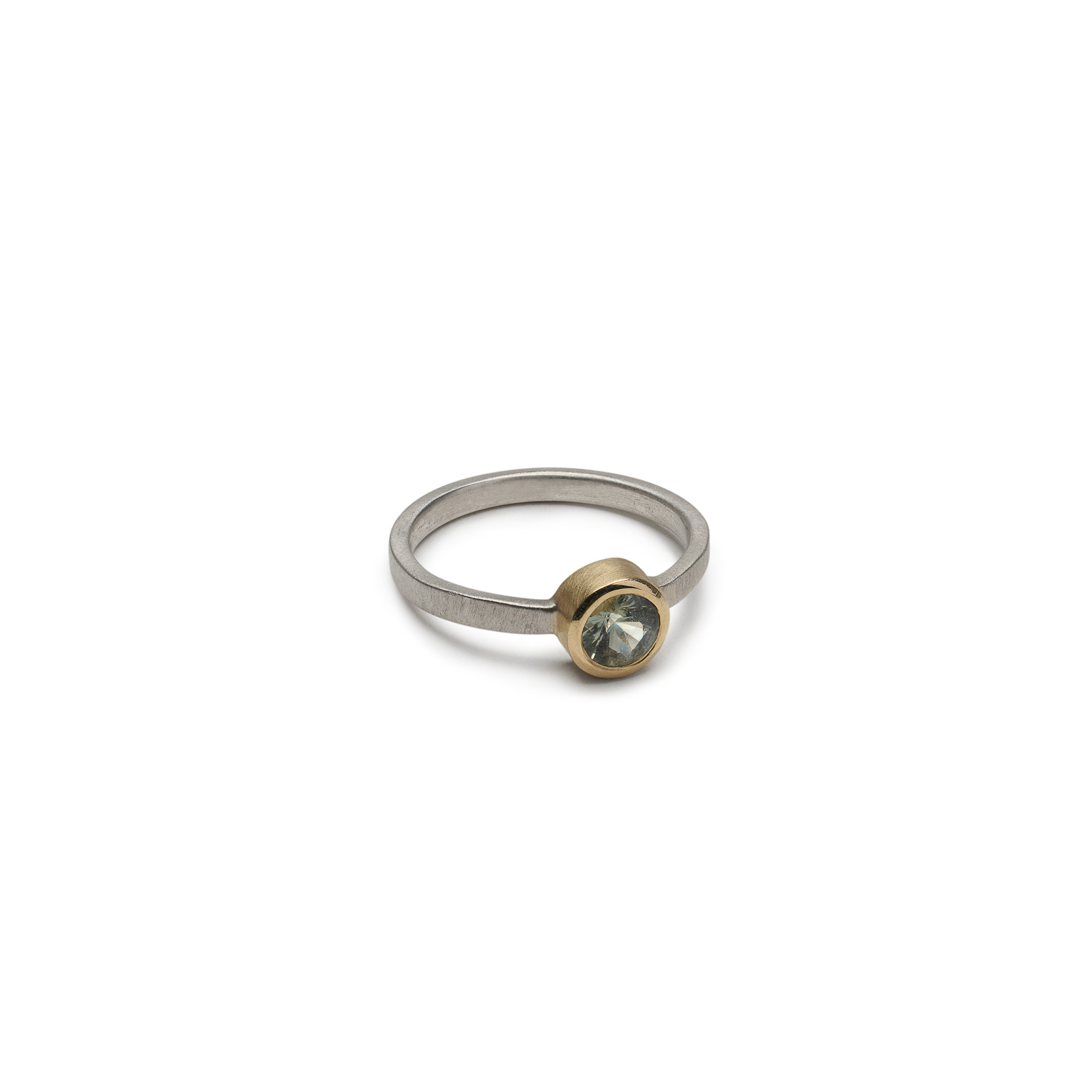 Verdant Ring with green sapphire in a modern mixed-metal setting